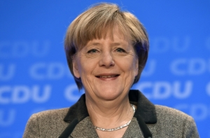 Российский политолог: Меркель может оказать давление на власти Украины