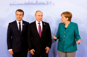 На саммите G20 проходит встреча Путина, Меркель и Макрона